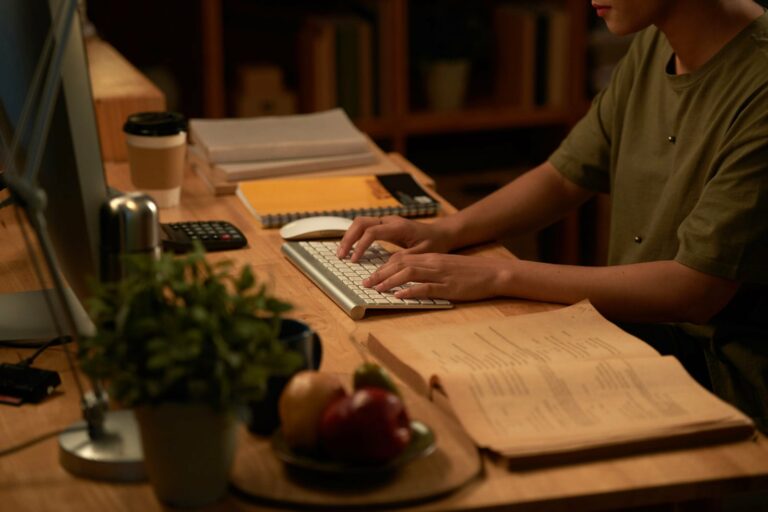 Staff member works on computer